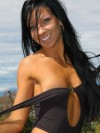 Trista strips off her sexy black body suit outdoors