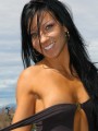 Trista strips off her sexy black body suit outdoors