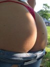 Heidi pulls off her jeans to show off her round ass