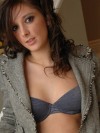 Melanie is slowly stripping out of her clothes after a long day at the office