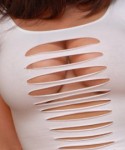 Krissy shows off her huge tits in a ripped top