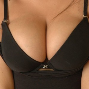 Teen with huge tits popping out of her bra