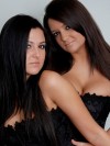 Brooke and Carmen in tight corsets