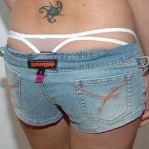 Kalees white thong is peeking out of her little jean shorts