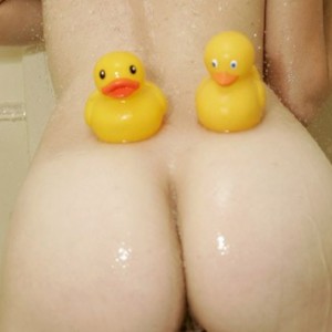 Emma has a shower with lots of bubbles and her rubber ducks