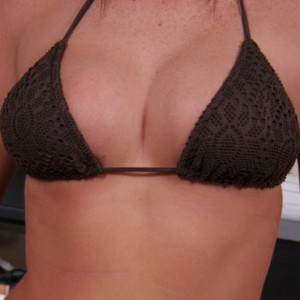 Alyssas huge perky boobs are barely covered by her tiny bikini top