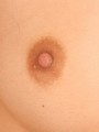 Watch as a teen shows off her perfect round hard nipples