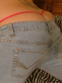 Blonde teen Marylin shows off her tight round ass in tight jeans with her g-string peaking out