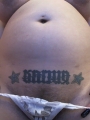 Horny pregnant porn star Georgia Peach shows off her swollen belly and unshaven pussy under her white lace g-string