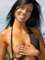 Trista strips off her sexy black body suit outdoors